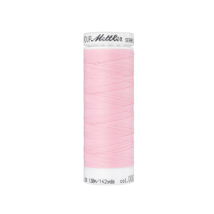 Spool of pink thread with Mettler Seraflex branding.
