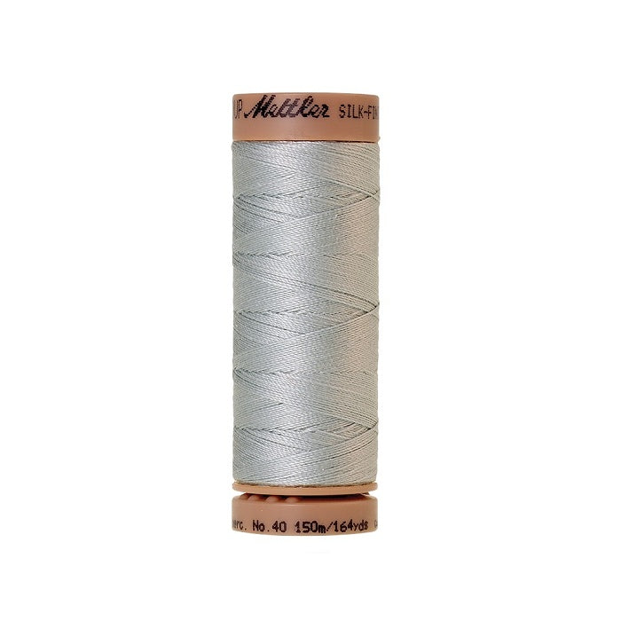 Grey thread with Mettler Cotton 40 branding.