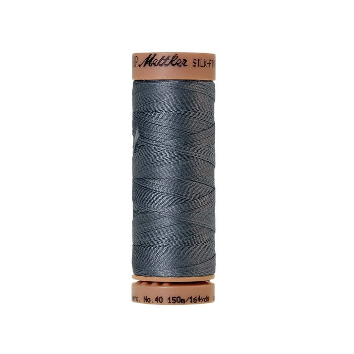 Grey thread with Mettler Cotton 40 branding.