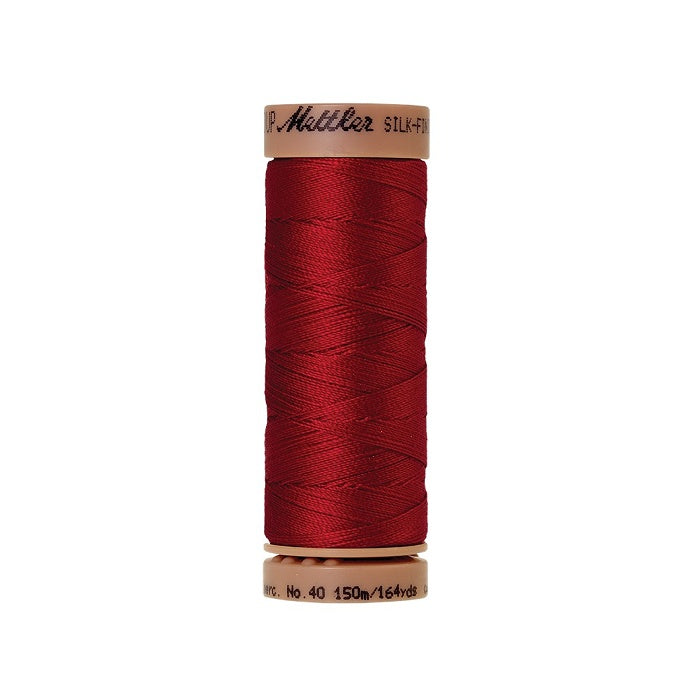 Red thread with Mettler Cotton 40 branding.