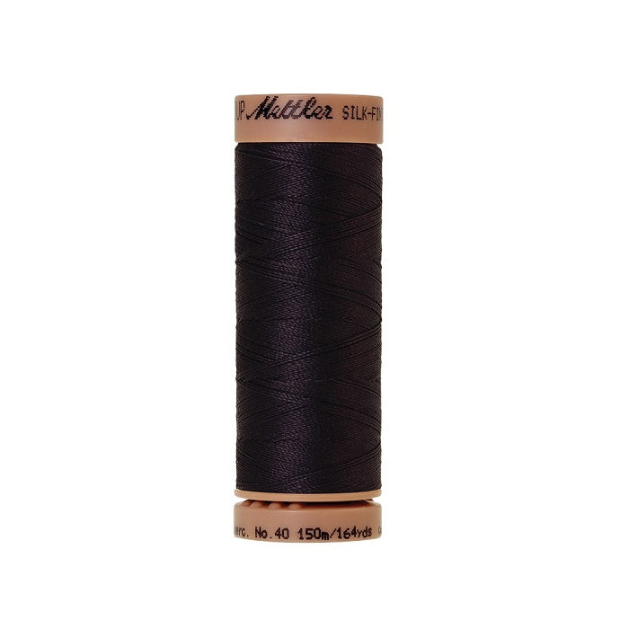 Very dark blue thread with Mettler Cotton 40 branding.