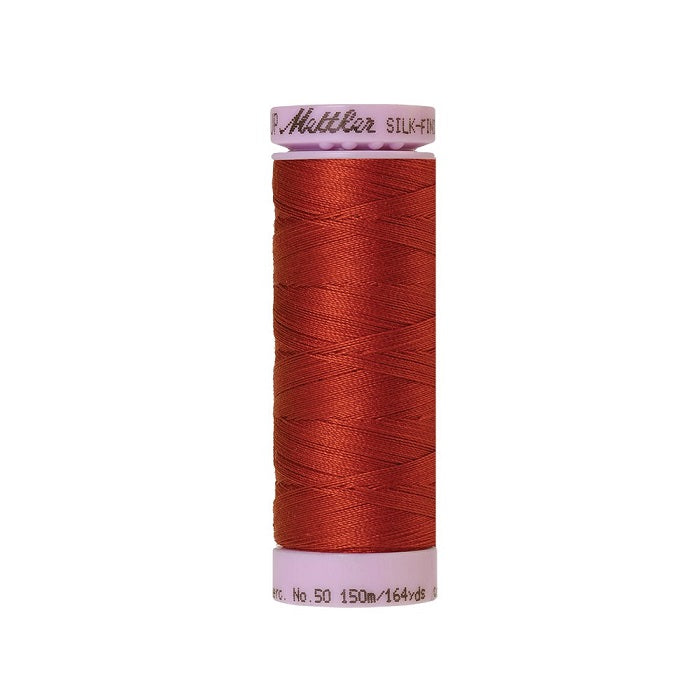 Red thread with Mettler Cotton 50 branding.