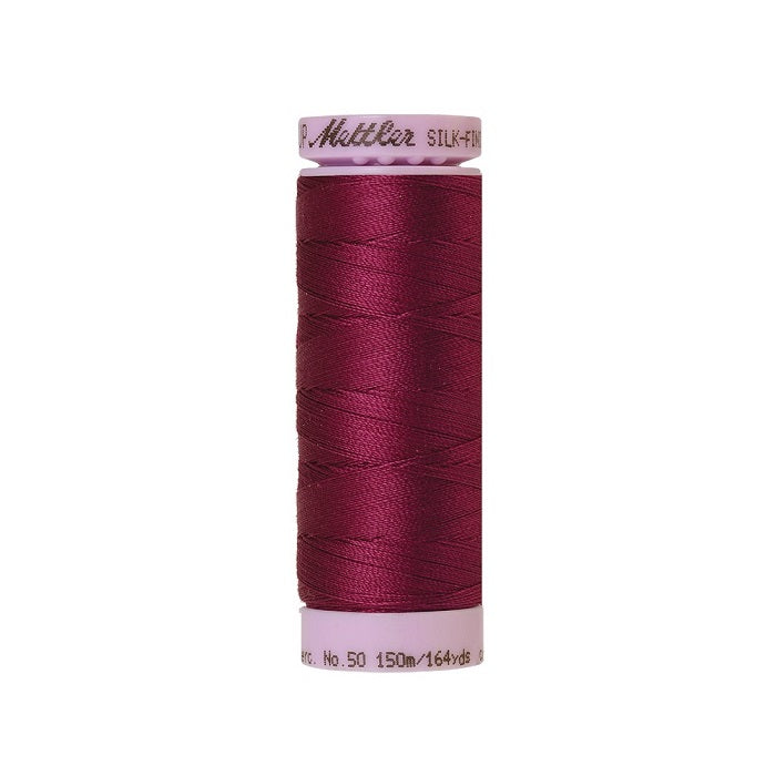 Dark red thread with Mettler Cotton 50 branding.