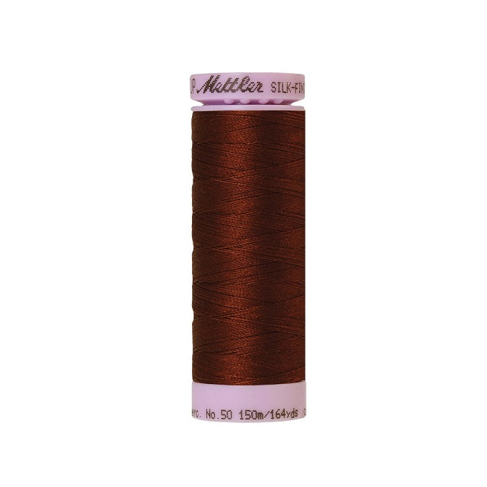 Dark brown thread with Mettler Cotton 50 branding.