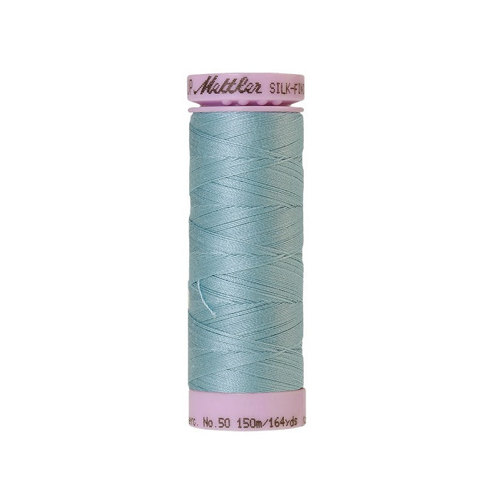 Light blue thread with Mettler Cotton 50 branding.