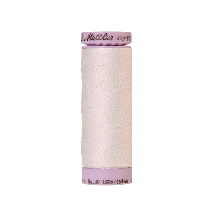 White thread with Mettler Cotton 50 branding.