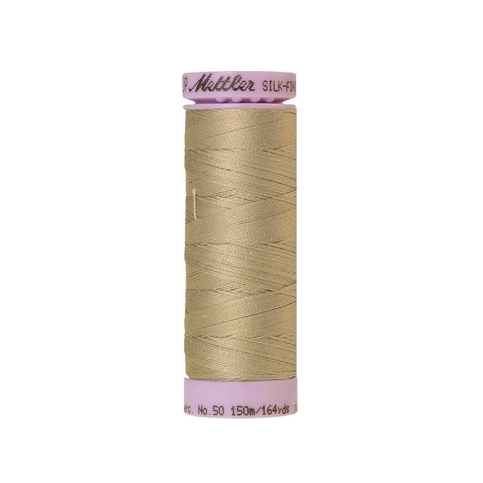 Beige thread with Mettler Cotton 50 branding.