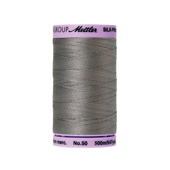Grey thread with Mettler Cotton 50 branding.