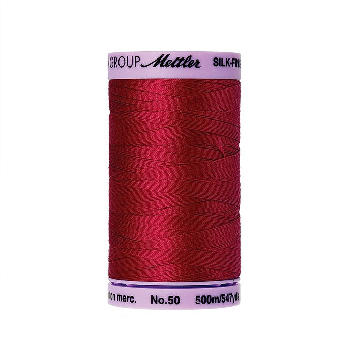 Red thread with Mettler Cotton 50 branding.