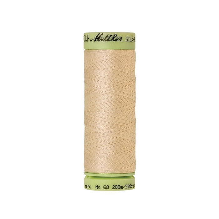 Beige thread with Mettler Cotton 60 branding.