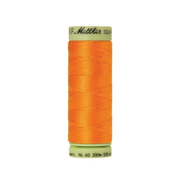 Orange thread with Mettler Cotton 60 branding.