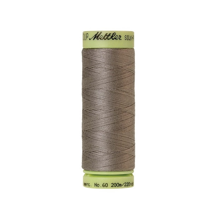Light brown thread with Mettler Cotton 60 branding.