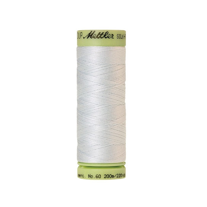 Very pale green thread with Mettler Cotton 60 branding.