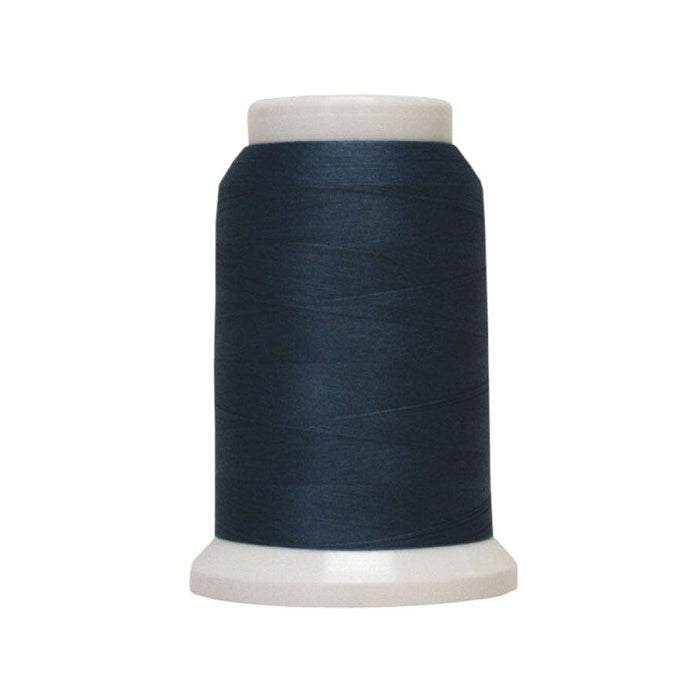 Spool of dark blue woolly poly thread.