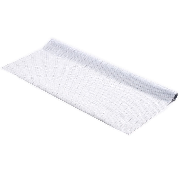 Roll of white pattern paper with blue grid lines.