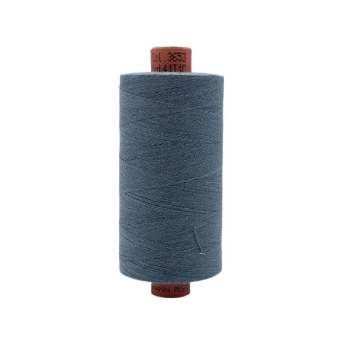 Spool of dark slate blue thread with Rasant branding.