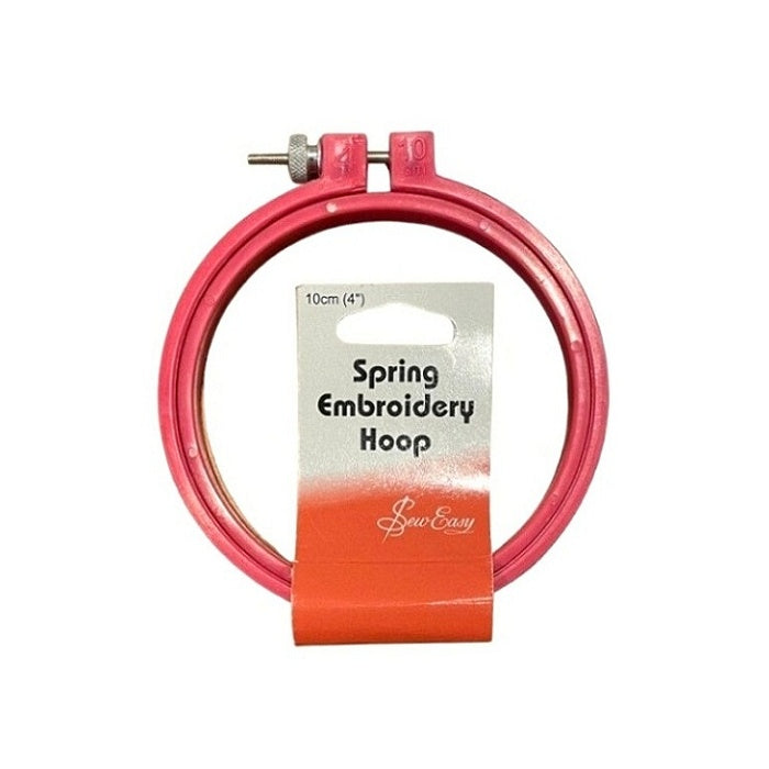 Round, pink plastic embroidery hoop with birch branding.