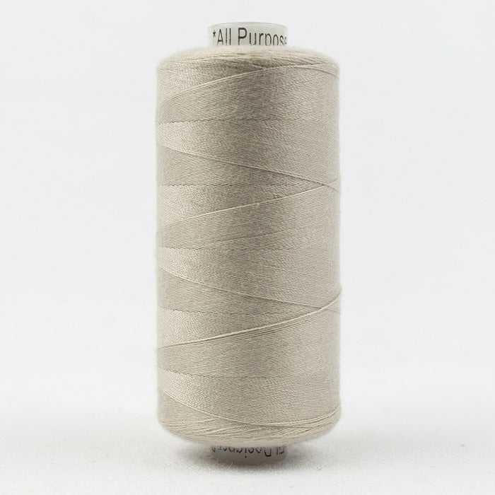 Spool of palest beige thread with Designer branding.