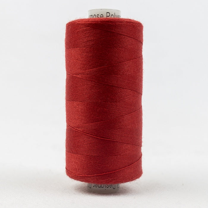 Spool of crimson red thread with Designer branding.