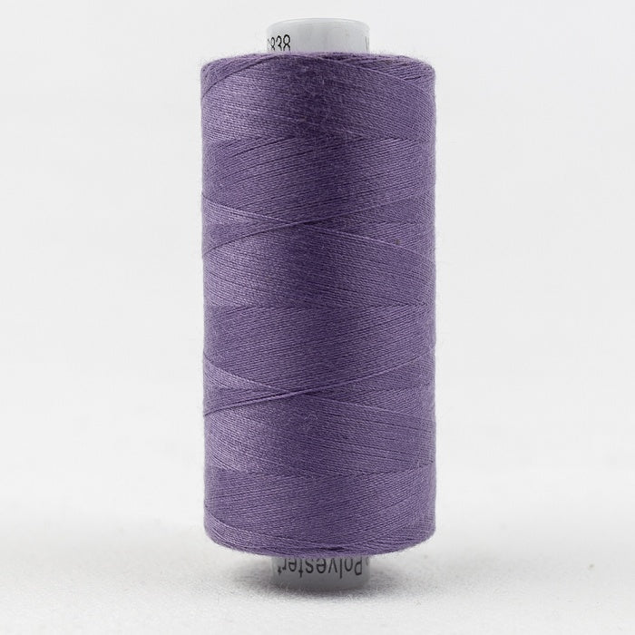 Spool of purple thread with Designer branding.
