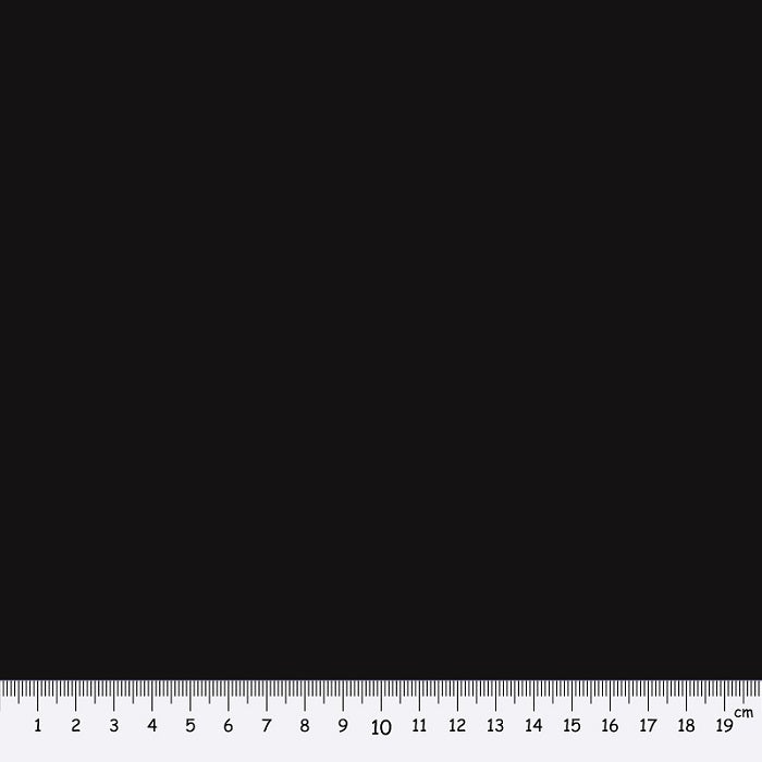 Black fabric swatch with a ruler at the bottom for scale.