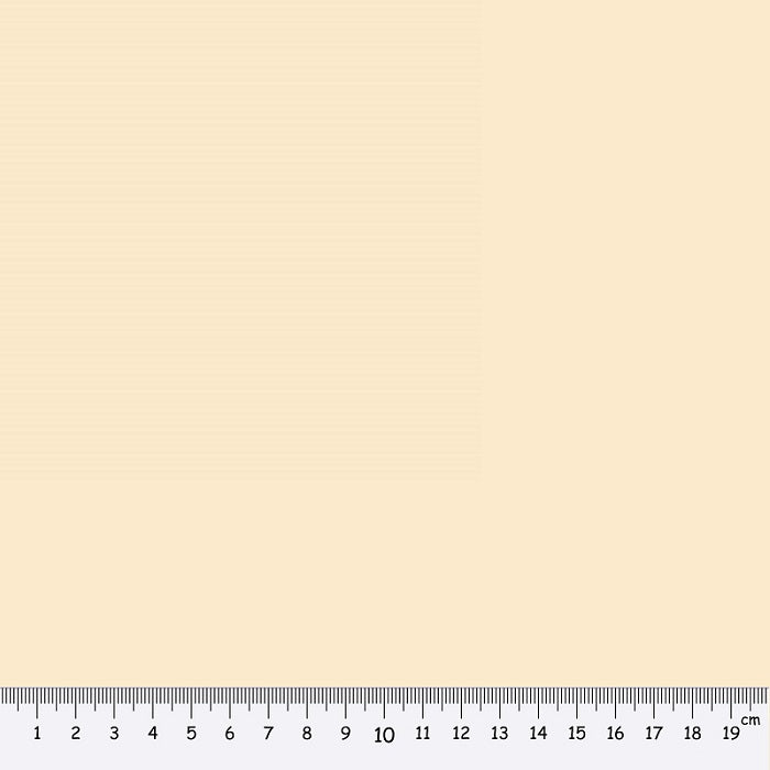 Beige fabric swatch with a ruler at the bottom for scale.