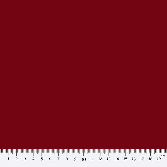 Dark red fabric swatch with a ruler at the bottom for scale.