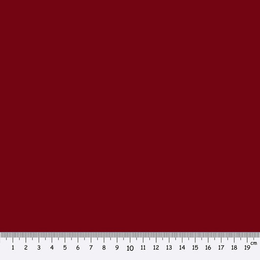 Dark red fabric swatch with a ruler at the bottom for scale.