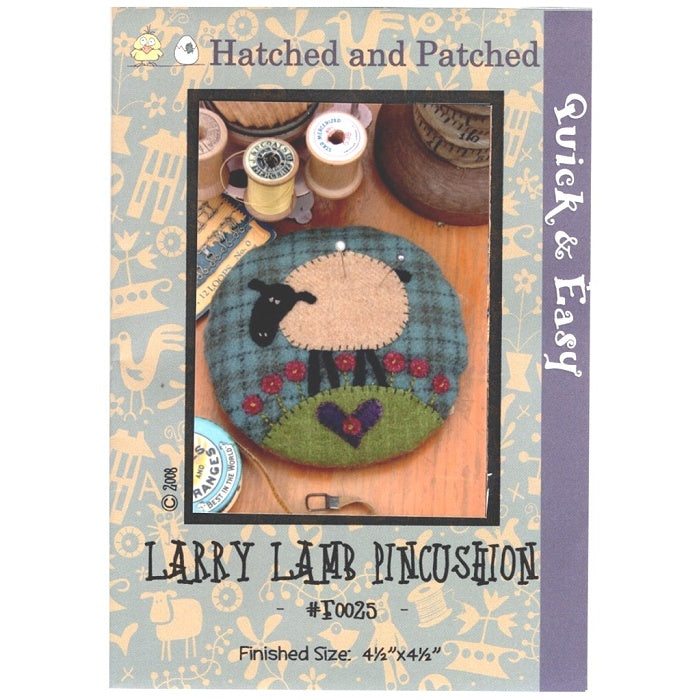 Pattern cover of plaid pincushion with black faced lamb applique.