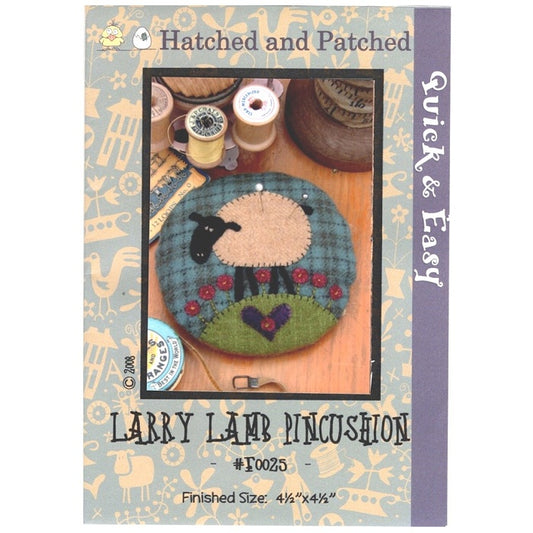 Pattern cover of plaid pincushion with black faced lamb applique.
