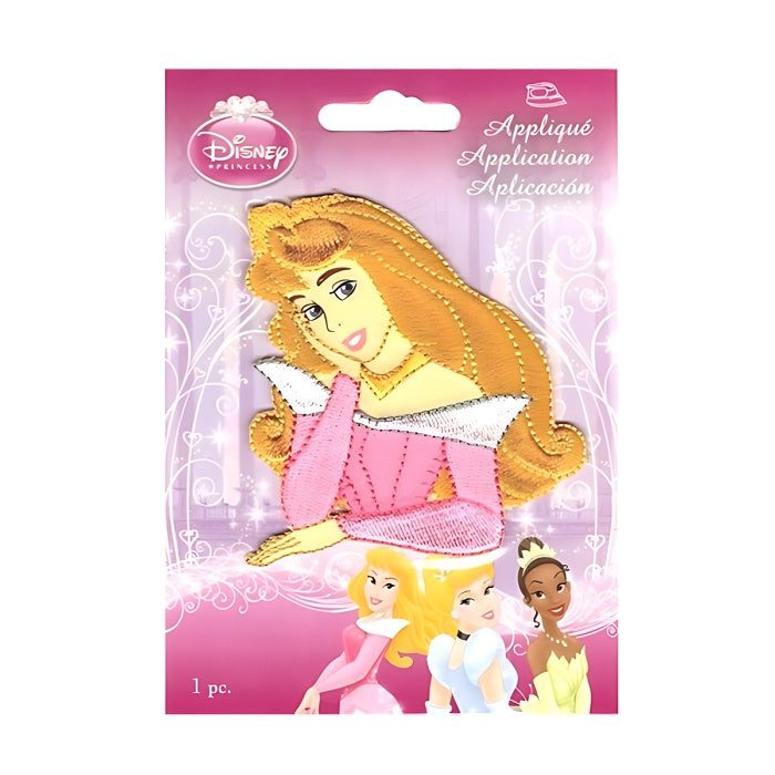 Applique of Princess with tilted head resting on hand.