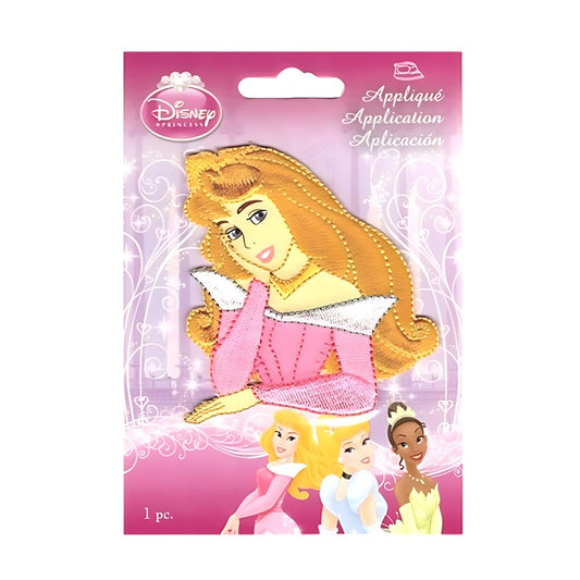 Applique of Princess with tilted head resting on hand.