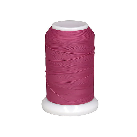 Spool of dark pink woolly nylon thread.