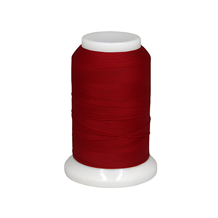 Spool of red woolly nylon thread.