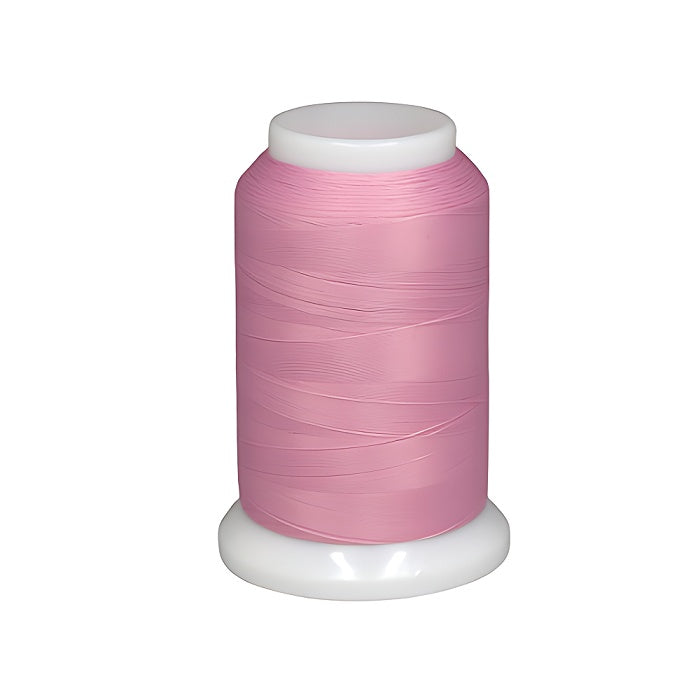 Spool of pink woolly nylon thread.