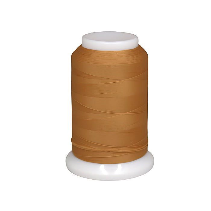 Spool of tan brown woolly nylon thread.