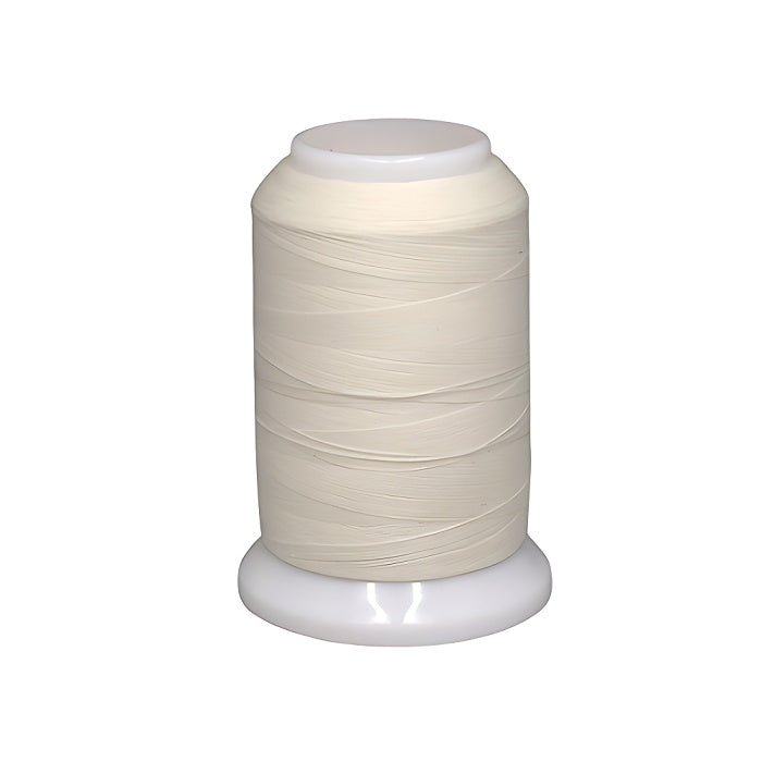 Spool of cream woolly nylon thread.