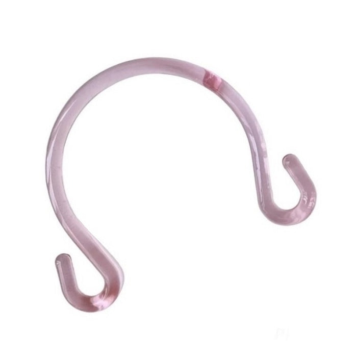 Transparent pink plastic teapot shaped bag handle.