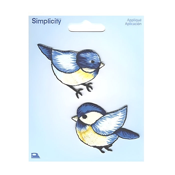 Two blue and yellow birds on a Simplicity branded card.