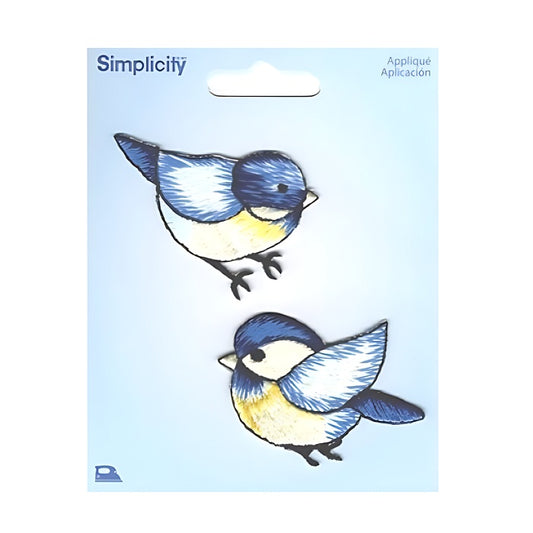Two blue and yellow birds on a Simplicity branded card.
