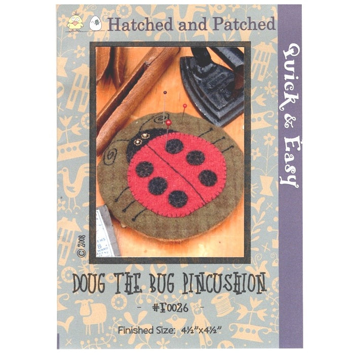 Pattern cover of pincushion with red ladybug applique.