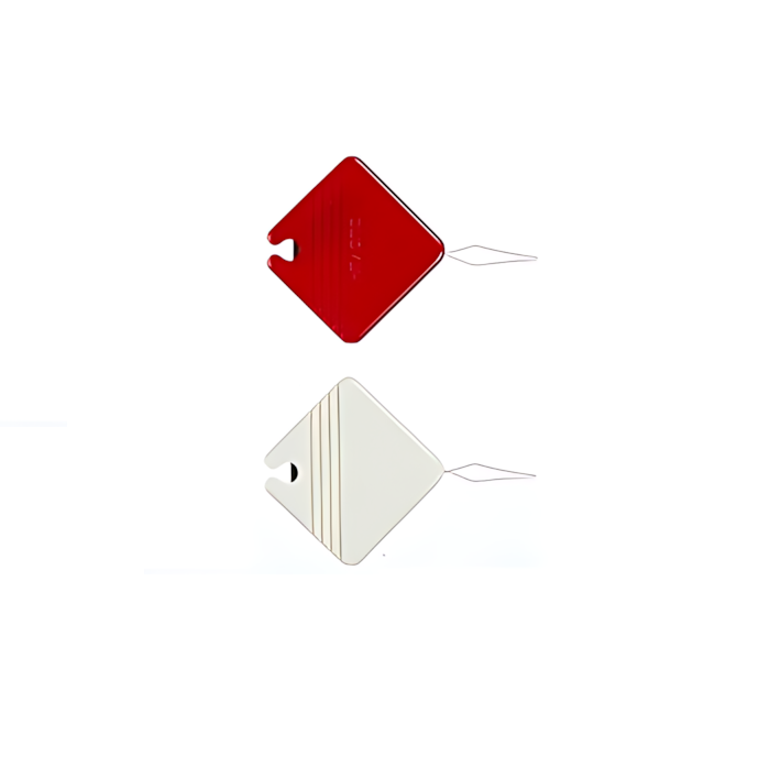 Two small square thread cutters, one red and one white.