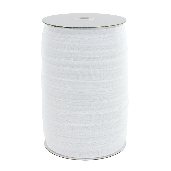 Carboard roll of white cotton tape.