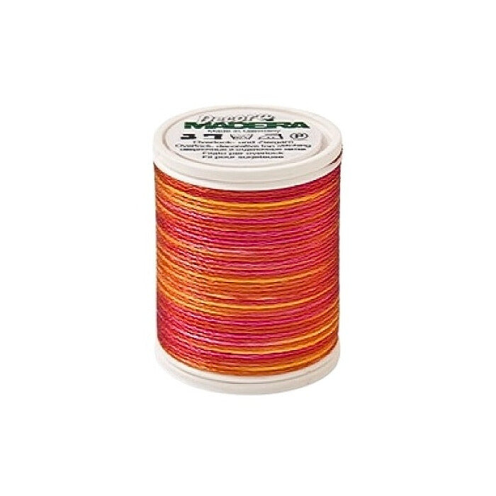 Spool of red variagated thread with Madeira branding.