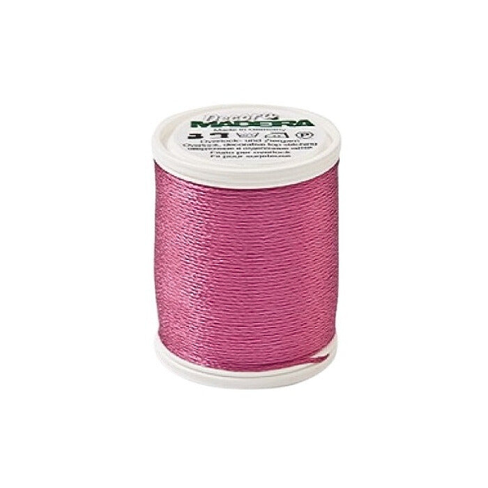 Spool of pink thread with Madeira branding.
