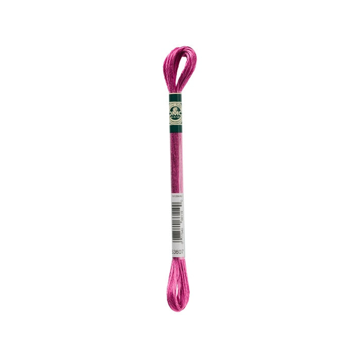 Skein of dark pink embroidery floss with DMC branding.
