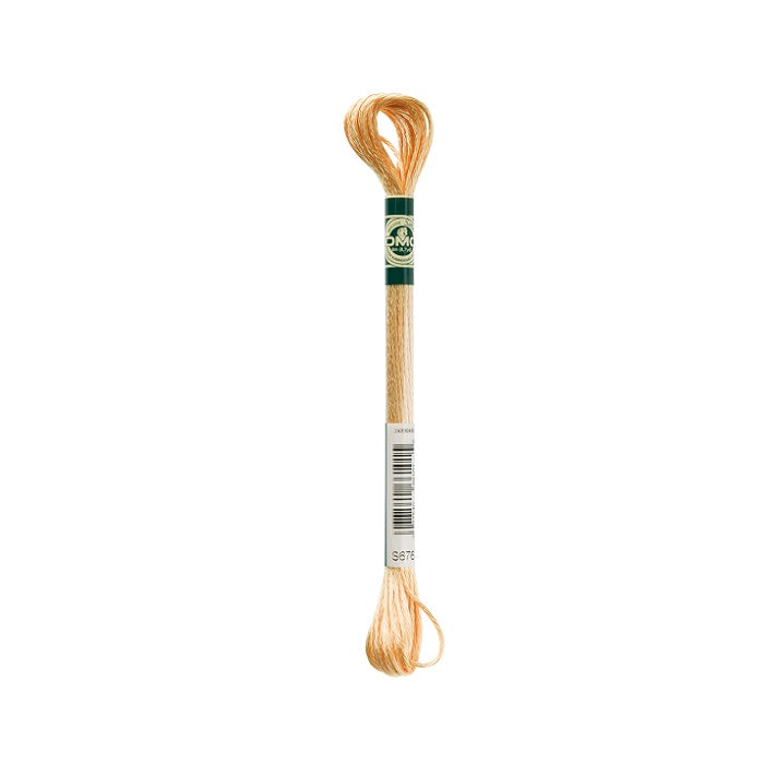 Skein of beige embroidery floss with DMC branding.