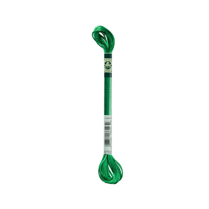 Skein of bright green embroidery floss with DMC branding.