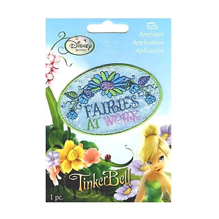 Oval floral applique with Fairies At Work wording.