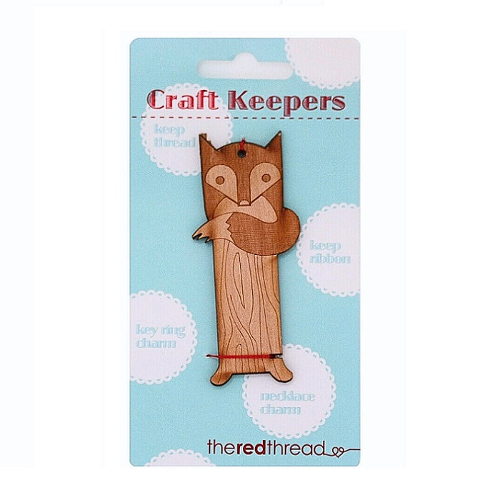 Wooden fox shaped floss keeper.